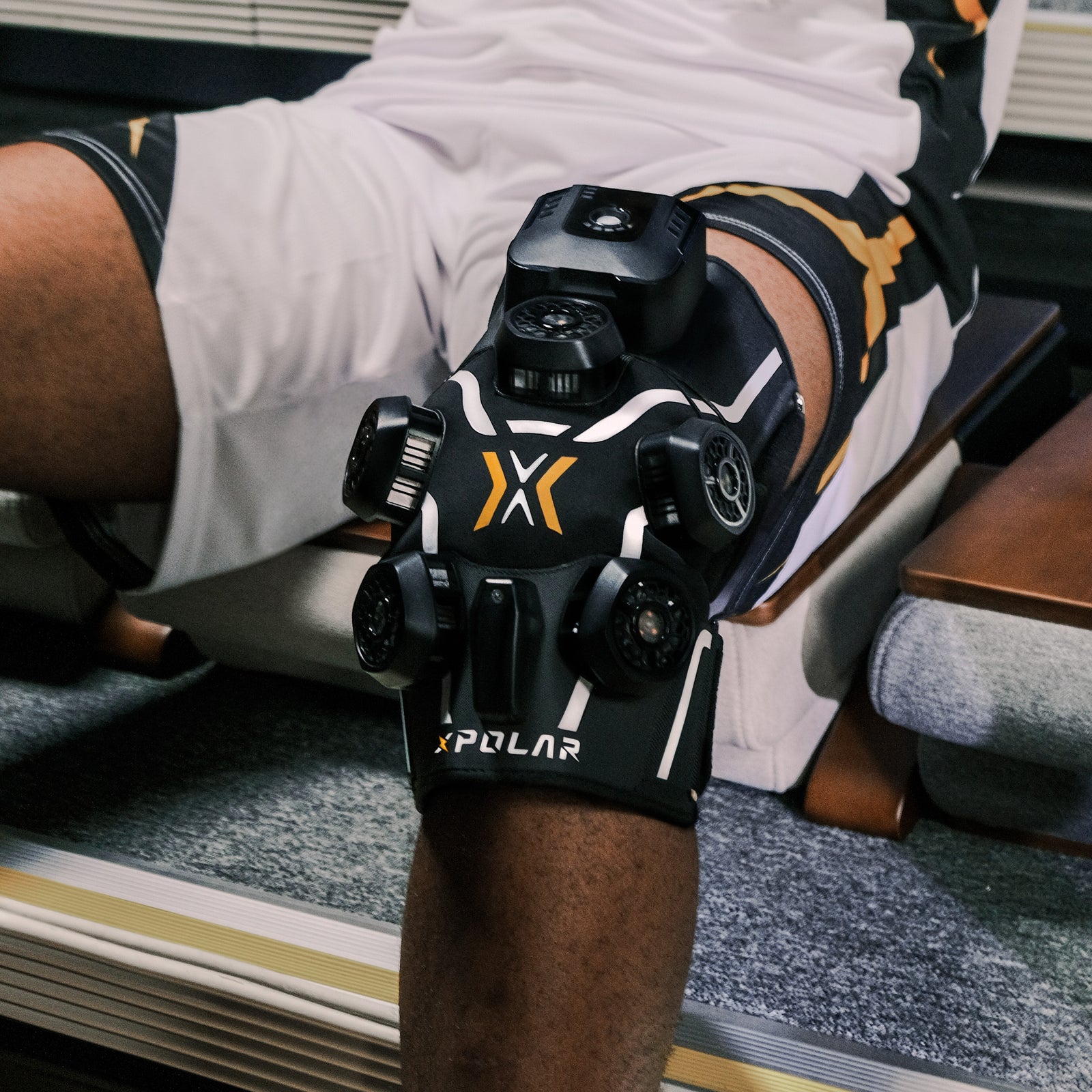 XPOLAR X2 strapped to knee, in-home usage scene